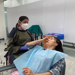 Dr. Puja Bansal caring for a patient during treatment