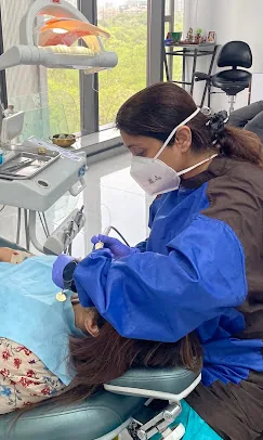 Dr. Puja Bansal at work in the operatory