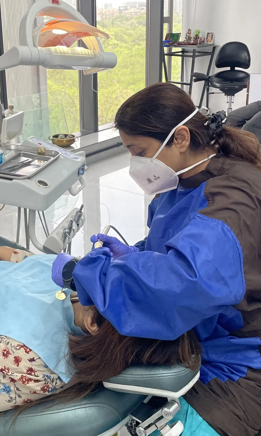 Dr. Puja Bansal at work in the operatory