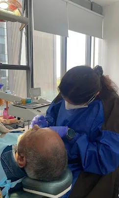 Dr. Puja Bansal using modern dental equipment